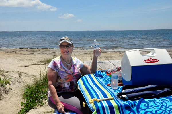 Karen Duquette enjoying lunch on the beach